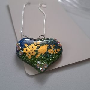 Golden bird and flowers necklace